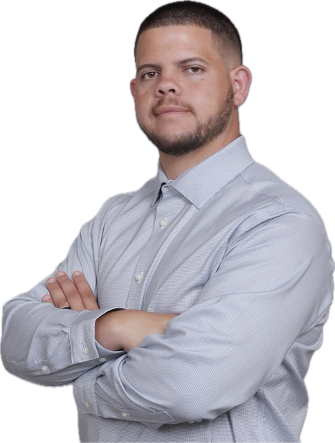 Vertical image of a man in a formal button-up shirt with his arms crossed, cropped above the waist and below the head. He ...